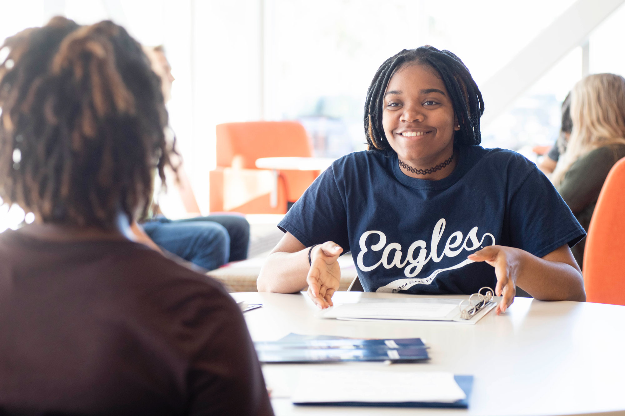 First year Georgia Southern Freshman enjoys meeting new people in the common space after admissions.