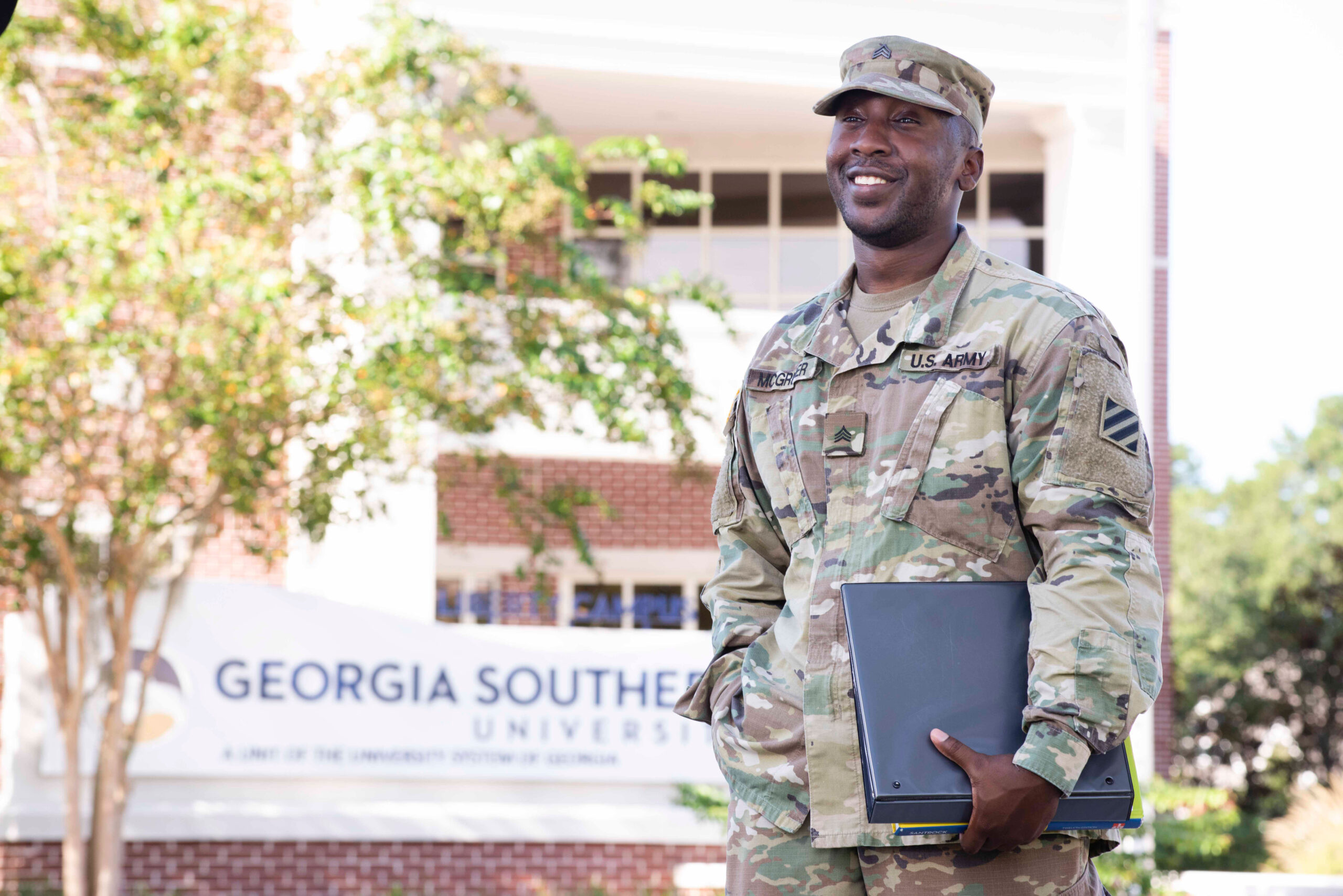 A military veteran strolls across campus in uniform as he completes his educational goals at Georgia Southern.