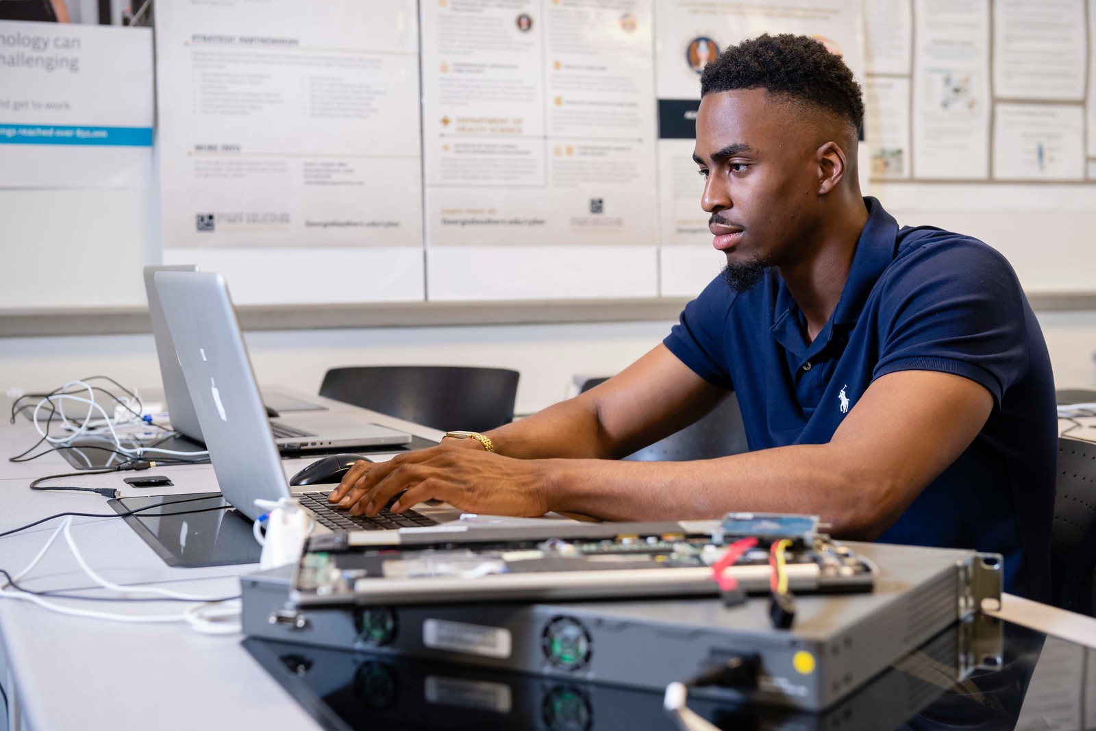 Cybercrime employee interacting with his computer