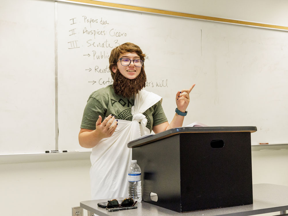 Georgia Southern student giving a presentation on historical account, showcasing a historical figure in significant era.