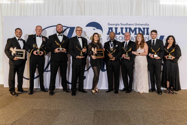Paul Newman, retired Major General Randall V. Simmons, Jr., Matt Wise, Ronny Just, Mary Githens, Georj Lewis, Ed.D., Commissioner Russell McMurry, Michelle McMurry, John Havenar and Cecilia Arango. 