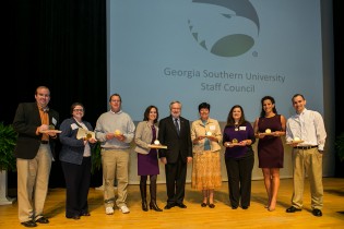 During the event, eight staff members were honored with Awards of Merit. From left:  Jeff Blythe, Sara Bailey, Michael Bochian (on behalf of Jesse Hopkins), Jaynie Gaskin, Dr. Brooks Keel, Valarie Kasay, Lynn Reaves, America Minc and Joshua Williams.
