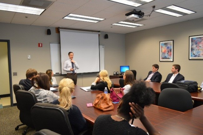 Business man speaking to class