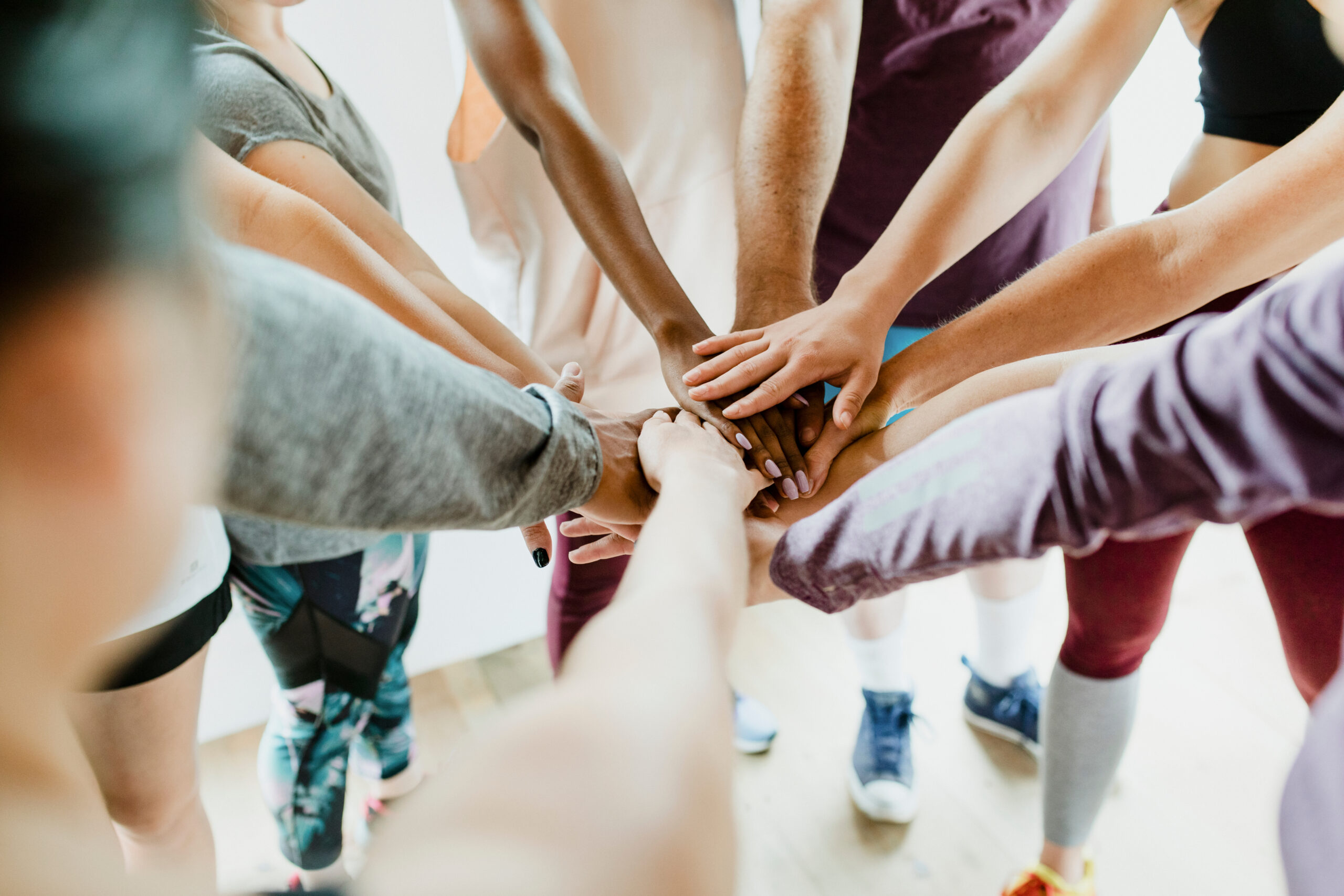 Group of people joining a community together