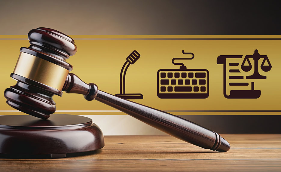 Gavel in the foreground with a yellow banner showing a microphone, keyboard, and legal document with scales behind it.